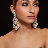 Rhodium Plated Zircon Studded With Pearl Drop Jhumka Dangle Earrings