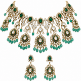 Luxurious Moissanite bridal choker necklace set featuring sparkling stones, emerald green accents, intricate floral motifs, and matching statement earrings for a regal wedding look.